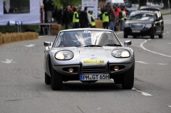 A white Marcos sports car on the road at a rally, SOLITUDE REVIVAL 2011, Stuttgart, Baden-Wuerttemberg, Germany, Europe
