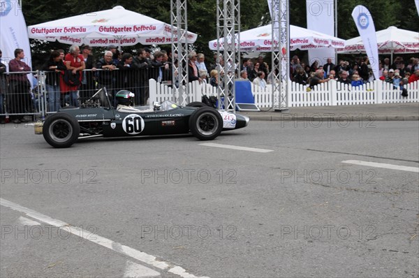 A classic black formula racing car with number 60 surrounded by spectators, SOLITUDE REVIVAL 2011, Stuttgart, Baden-Wuerttemberg, Germany, Europe