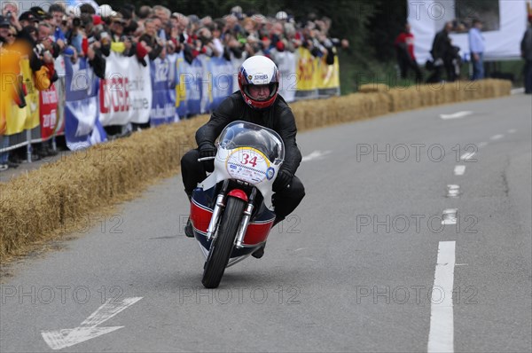 A motorcyclist in racing action on a closed-off track in front of an audience, SOLITUDE REVIVAL 2011, Stuttgart, Baden-Wuerttemberg, Germany, Europe