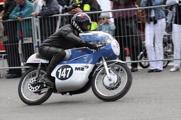 A focussed motorbike racer during a race in front of spectators, SOLITUDE REVIVAL 2011, Stuttgart, Baden-Wuerttemberg, Germany, Europe