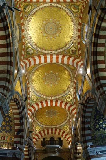 Church of Notre-Dame de la Garde, Marseille, interior view of a church with a golden dome and decorated columns, Marseille, Departement Bouches du Rhone, Region Provence Alpes Cote d'Azur, France, Europe