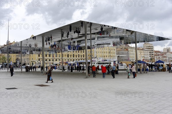 Marseille, People walking across a public square with a large reflective canopy, Marseille, Departement Bouches du Rhone, Region Provence Alpes Cote d'Azur, France, Europe