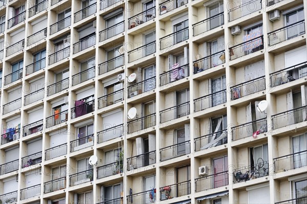 Marseille, Monotonous facade of a large apartment block with many balconies and washing lines, Marseille, Departement Bouches-du-Rhone, Provence-Alpes-Cote d'Azur region, France, Europe