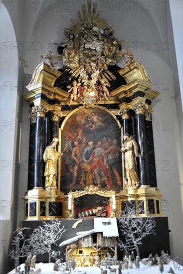 The Neumuenster Collegiate Abbey, Diocese of Wuerzburg, Wuerzburg, A richly decorated baroque altar with a nativity scene scene in the foreground, Wuerzburg, Lower Franconia, Bavaria, Germany, Europe