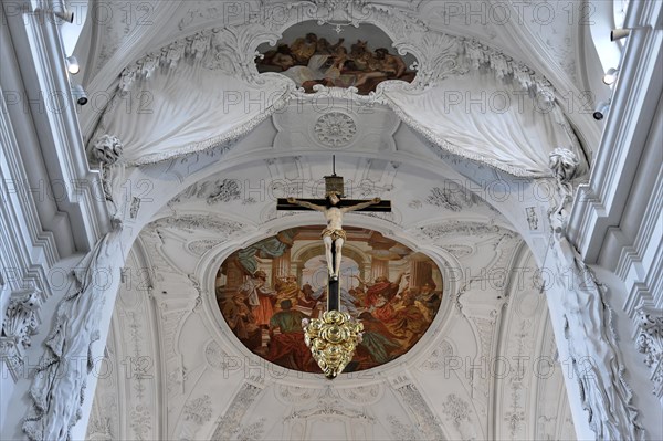 In the Neumuenster collegiate monastery, Wuerzburg, depiction of the crucifixion of Christ under a baroque vault with ornamental stucco work, Wuerzburg, Lower Franconia, Bavaria, Germany, Europe