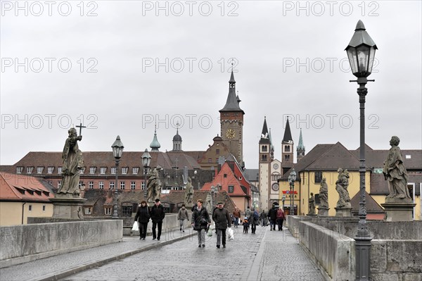 Wuerzburg, View of a busy street with statues and historic buildings in a European old town, Wuerzburg, Lower Franconia, Bavaria, Germany, Europe