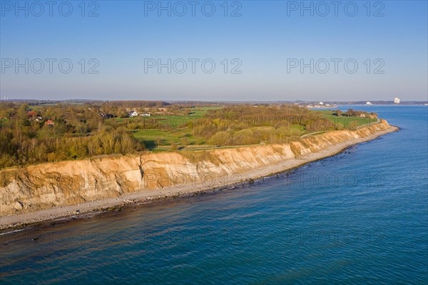 Aerial view over beach and Brodtener Ufer, Brodten Steilufer, cliff in the Bay of Luebeck along the Baltic Sea at sunrise, Schleswig-Holstein, Germany, Europe