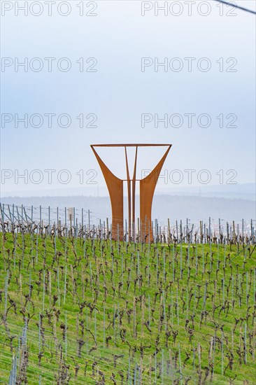 Large metal sculpture in the middle of a vineyard with a hilly landscape in the background, Jesus Grace Chruch, Weitblickweg, Easter hike, Hohenhaslach, Germany, Europe