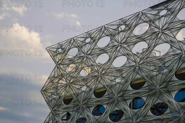 Reutlingen University, Reutlingen University, Texoversum, German University Building Award 2024 for TEXOVERSUM, modern architecture, facade made of carbon and glass fibres, mesh, innovative, identity-creating, unique facade, campus, place of learning, special, extraordinary new building for textile courses, light, airy, airy, holes, architectural eye-catcher, cloudy sky, Reutlingen, Baden-Wuerttemberg, Germany, Europe