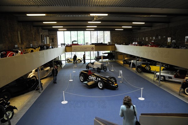 Deutsches Automuseum Langenburg, View over the upper level of a car museum with classic cars on display and visitors, Deutsches Automuseum Langenburg, Langenburg, Baden-Wuerttemberg, Germany, Europe