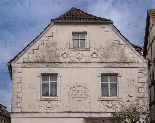 House facade with inscription: German house, German country, God protect you with a strong hand, Havelberg, Saxony-Anhalt, Germany, Europe