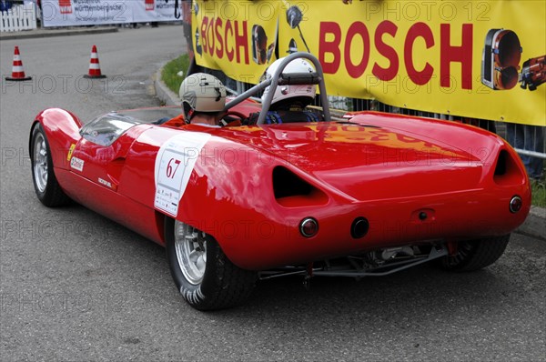 A red open-top racing car with a driver in full gear, SOLITUDE REVIVAL 2011, Stuttgart, Baden-Wuerttemberg, Germany, Europe