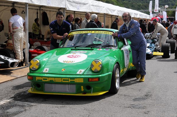 A green Porsche classic car with the number 1 and yellow accents at a race, SOLITUDE REVIVAL 2011, Stuttgart, Baden-Wuerttemberg, Germany, Europe