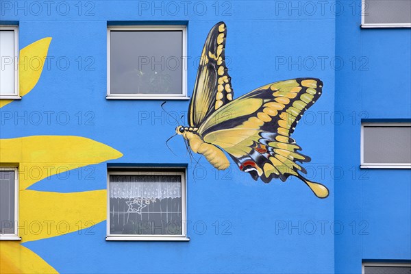 Sunflower house, painted swallowtail butterfly on a skyscraper, artist Ulrich Allgaier, Wuppertal, North Rhine-Westphalia, Germany, Europe
