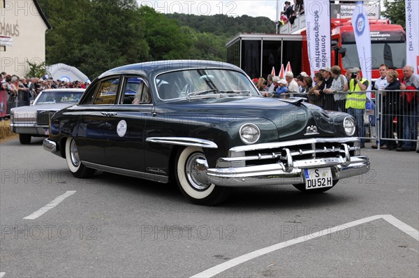 Dark blue Chevrolet classic car passing a group of spectators, SOLITUDE REVIVAL 2011, Stuttgart, Baden-Wuerttemberg, Germany, Europe