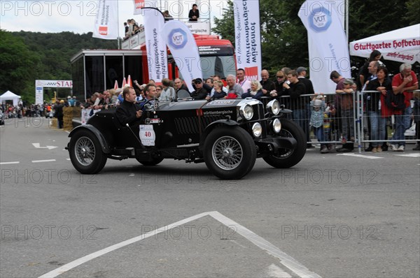 A black vintage car drives past spectators at a racing event, SOLITUDE REVIVAL 2011, Stuttgart, Baden-Wuerttemberg, Germany, Europe