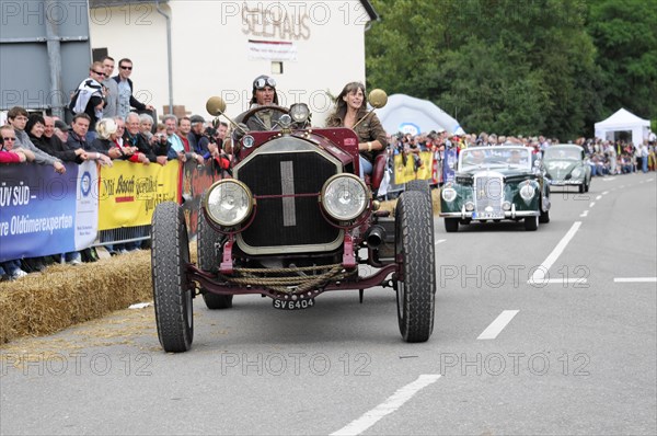 A classic car races in front of spectators on the street, SOLITUDE REVIVAL 2011, Stuttgart, Baden-Wuerttemberg, Germany, Europe