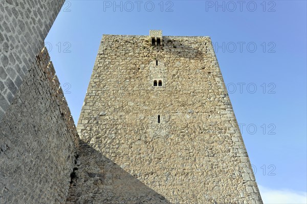 Jaen, Castillo de Santa Catalina on Jaen, View of an old stone defence defence tower in front of a clear sky, Jaen, Baeza, Ubeda, Andalusia, Spain, Europe