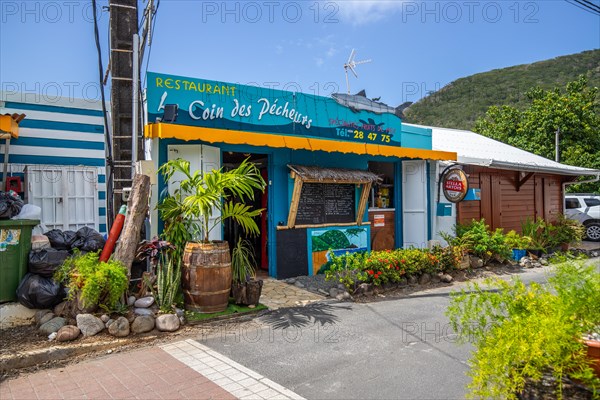 Deshaies, historic Caribbean wooden building of a street in Guadeloupe, Caribbean, French Antilles