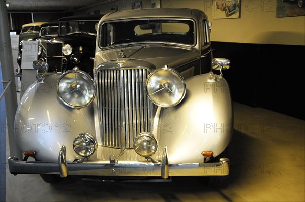 Deutsches Automuseum Langenburg, A grey, closed vintage car with chrome details is illuminated in an exhibition room, Deutsches Automuseum Langenburg, Langenburg, Baden-Wuerttemberg, Germany, Europe