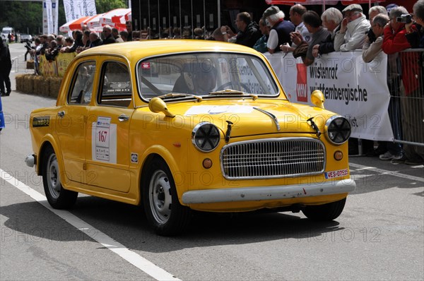 A small yellow car with starting number and accident damage at a classic car race, SOLITUDE REVIVAL 2011, Stuttgart, Baden-Wuerttemberg, Germany, Europe