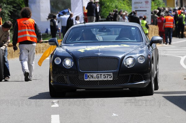 A dark blue Bentley drives on a street at an event in the sunshine, SOLITUDE REVIVAL 2011, Stuttgart, Baden-Wuerttemberg, Germany, Europe