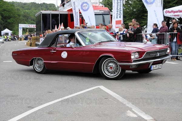 Red vintage car drives past a crowd at a car race, SOLITUDE REVIVAL 2011, Stuttgart, Baden-Wuerttemberg, Germany, Europe