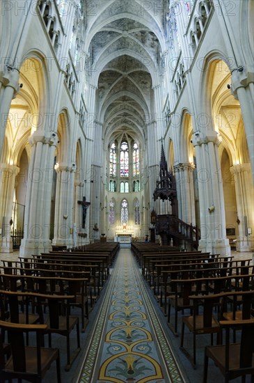 Church of Saint-Vincent-de-Paul, The interior of a church with a long central aisle leading to the illuminated altar area, Marseille, Departement Bouches-du-Rhone, Provence-Alpes-Cote d'Azur region, France, Europe