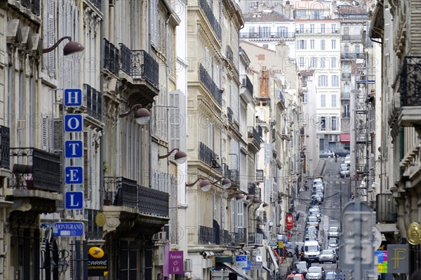 Marseille, view down the street with hotel signs, vehicles and old buildings, Marseille, Departement Bouches-du-Rhone, Region Provence-Alpes-Cote d'Azur, France, Europe