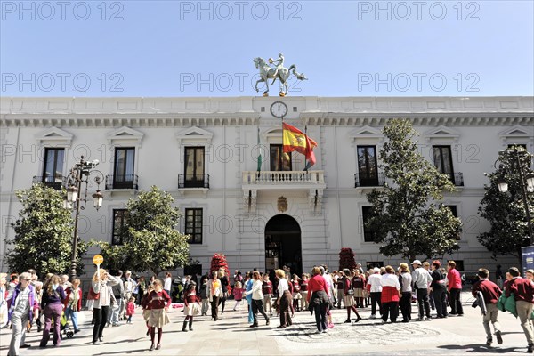 Granada, People gather in front of the town hall with statues and waving flags, Granada, Andalusia, Spain, Europe
