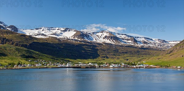 View over harbour and town Seyoisfjoerour along the fjord Seydisfjoerdur in summer, Eastern Region, Austurland, Iceland, Europe