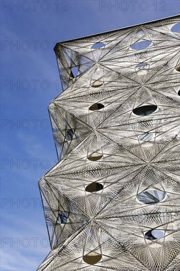 Reutlingen University, Reutlingen University, Texoversum, German University Building Award 2024 for TEXOVERSUM, modern architecture, facade made of carbon and glass fibres, mesh, innovative, identity-creating, unique facade, campus, place of learning, special, extraordinary new building for textile courses, light, airy, airy, holes, detail, architectural eye-catcher, Reutlingen, Baden-Wuerttemberg, Germany, Europe