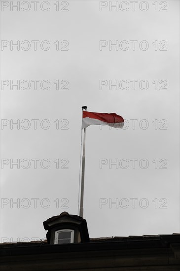 Langenburg Castle, A waving flag on a flagpole against a grey, cloudy sky, Langenburg Castle, Langenburg, Baden-Wuerttemberg, Germany, Europe