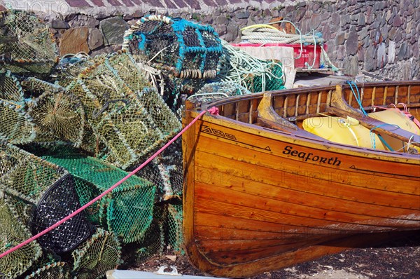 Simple rowing boat next to lobster cages, Plockton, Highlands, Scotland, Great Britain