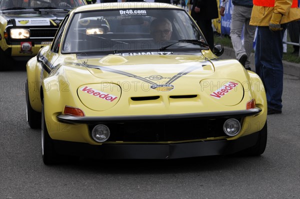A yellow sports car with racing numbers and sponsor logos during a race, SOLITUDE REVIVAL 2011, Stuttgart, Baden-Wuerttemberg, Germany, Europe