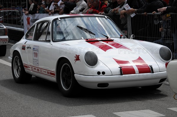 A white Porsche racing car with racing stripes takes part in a car race, spectators in the background, SOLITUDE REVIVAL 2011, Stuttgart, Baden-Wuerttemberg, Germany, Europe