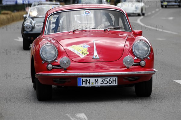 A red classic Porsche at a classic car race on the road, SOLITUDE REVIVAL 2011, Stuttgart, Baden-Wuerttemberg, Germany, Europe