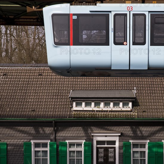 New suspension railway in front of a traditional Bergisch house in Vohwinkel, Wuppertal, Bergisches Land, North Rhine-Westphalia, Germany, Europe