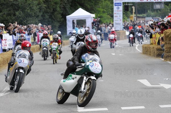 Motorcyclists compete on the race track, surrounded by spectators, SOLITUDE REVIVAL 2011, Stuttgart, Baden-Wuerttemberg, Germany, Europe