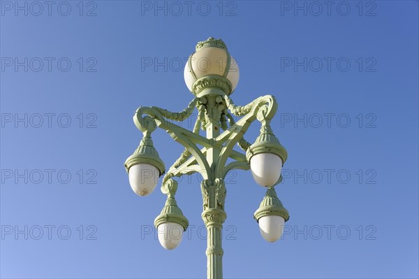Marseille, An ornate green street lamp with five lights against a clear blue sky, Marseille, Departement Bouches-du-Rhone, Region Provence-Alpes-Cote d'Azur, France, Europe