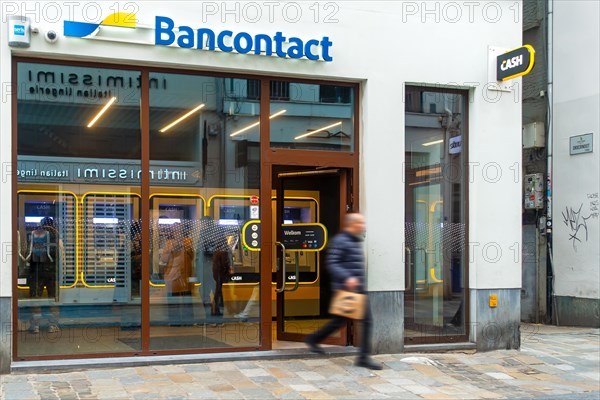 Indoor ATM cash dispenser of bank neutral Bancontact CASH point in shopping street in the city centre of Ghent, Gent, East Flanders, Belgium, Europe