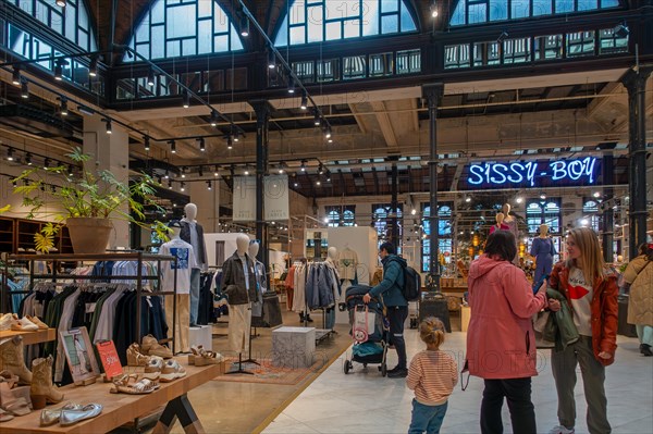 Shopping centre De Post with trendy fashion shops, boutiques and restaurant in the former old post office of the city Ghent, East Flanders, Belgium, Europe