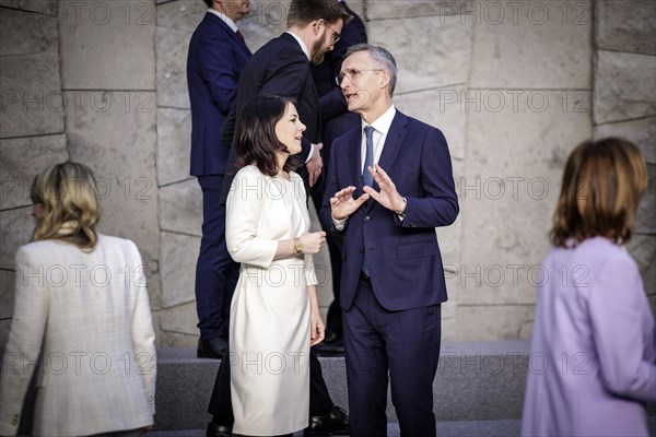 (L-R) Annalena Baerbock, Federal Foreign Minister, in conversation with Jens Stoltenberg, NATO Secretary General, at the family photo during the meeting of NATO foreign ministers. Brussels, 03.04.2024. Photographed on behalf of the Federal Foreign Office