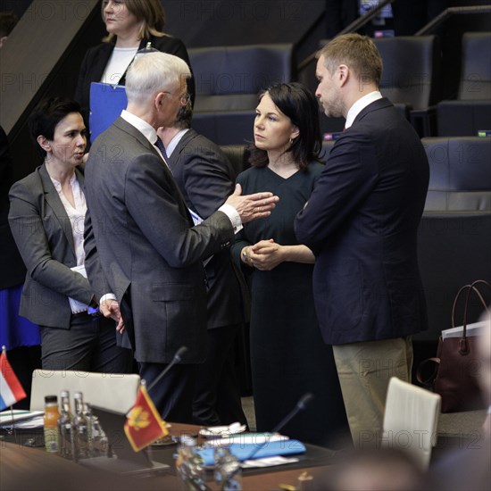 (L-R) Krisjanis Karins, Foreign Minister of Latvia, Annalena Baerbock, Federal Foreign Minister, in conversation with Gabrielius Landsbergis, Foreign Minister of Lithuania, in front of the start of a meeting of the North Atlantic-Ukraine Council in the format of the Foreign Ministers of the States Parties and Ukraine. Brussels, 04.04.2024. Photographed on behalf of the Federal Foreign Office