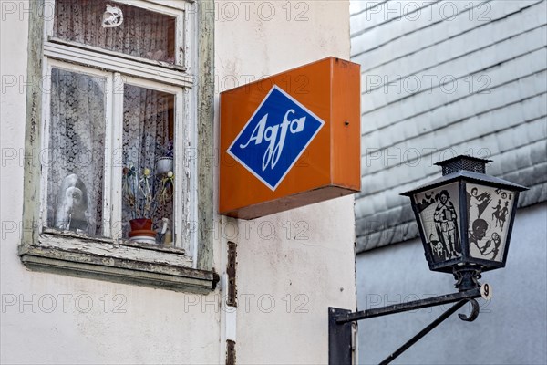 Cantilever sign, AGFA Film und Foto advertising sign, light box, abandoned photo shop, old window, street lamp, dilapidated house, old town, Ortenberg, Vogelsberg, Wetterau, Hesse, Germany, Europe