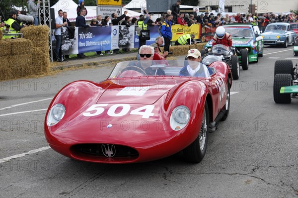 A red classic racing car with starting number 504 drives past spectators, SOLITUDE REVIVAL 2011, Stuttgart, Baden-Wuerttemberg, Germany, Europe