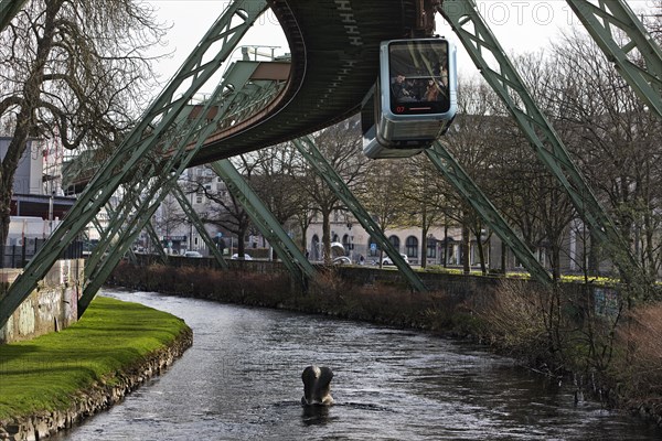 Suspension railway and sculpture by Bernd Bergkemper in the river Wupper commemorating the jump of the elephant Tuffi, Wuppertal, Germany, Europe