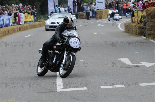 A motorcyclist during a race at speed on the track, SOLITUDE REVIVAL 2011, Stuttgart, Baden-Wuerttemberg, Germany, Europe