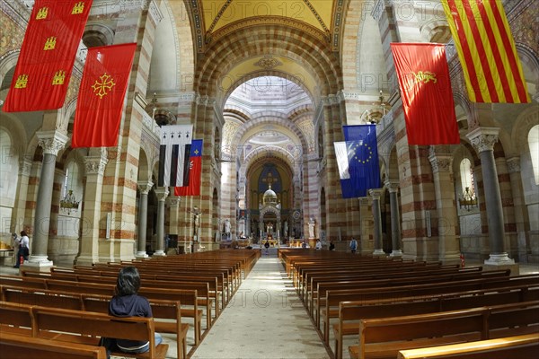 Marseille Cathedral or Cathedrale Sainte-Marie-Majeure de Marseille, 1852-1896, Marseille, Interior view of a church with flags and symmetrical architecture with natural light, Marseille, Departement Bouches-du-Rhone, Region Provence-Alpes-Cote d'Azur, France, Europe