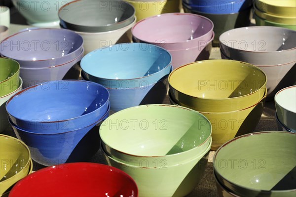 Pottery bowls, pots, colourful stacked clay bowls at an outdoor market, Marseille, Departement Bouches du Rhone, Region Provence Alpes Cote d'Azur, France, Europe